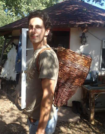 Sespe Miller wearing a tradiitoinal Chumash willow basket